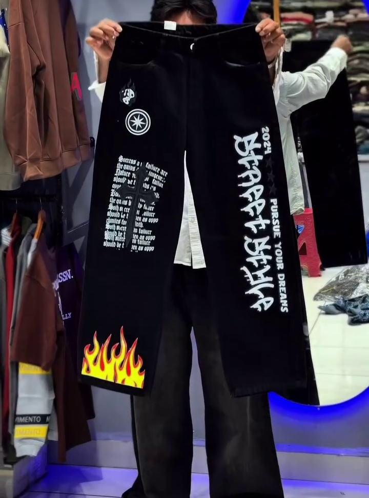 Light Blue Wide-Leg Denim Jeans with Bold Tribal Graphic Design