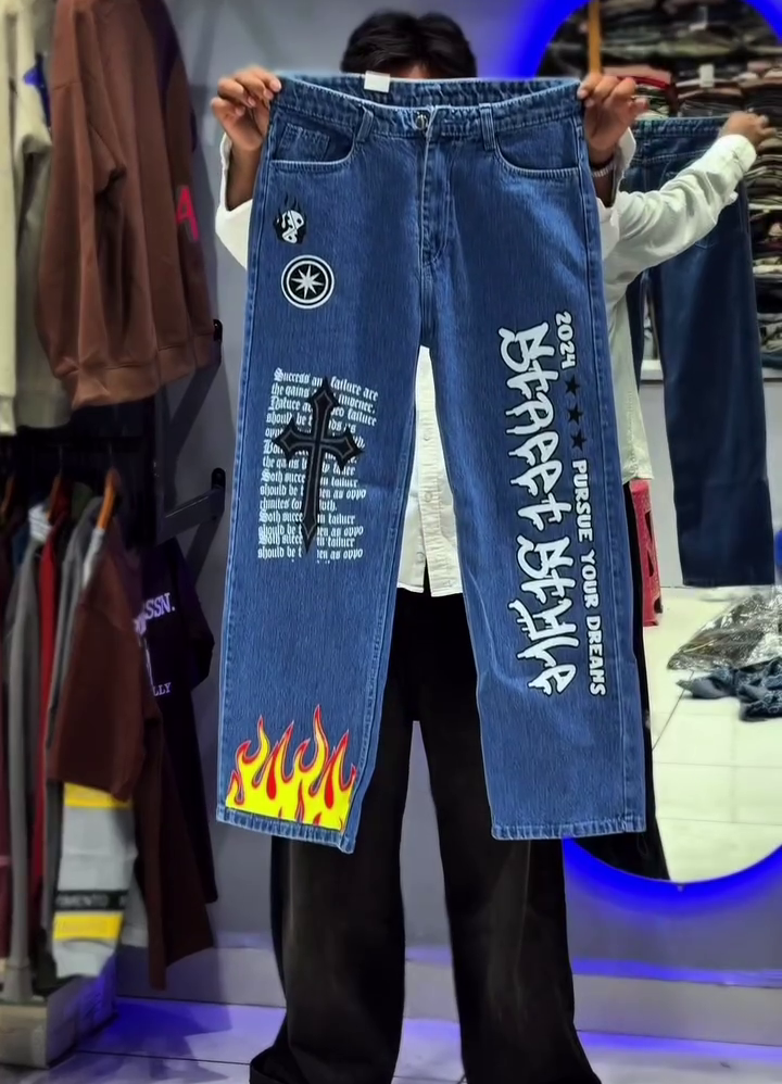 Light Blue Wide-Leg Denim Jeans with Bold Tribal Graphic Design