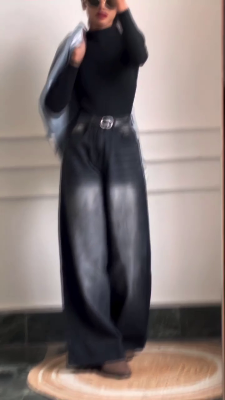 Modern Black High-Neck Top with Wide-Leg Leather Pants