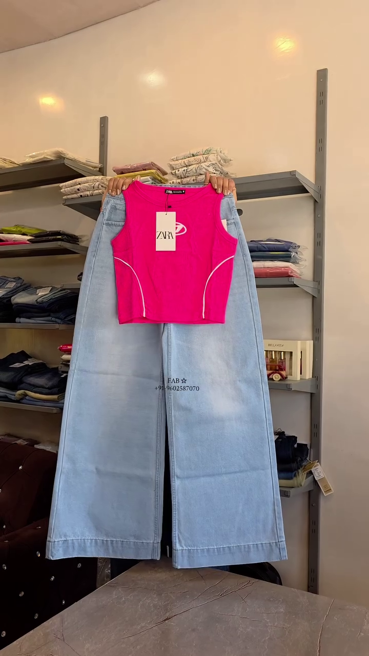 Trendy Pink Sleeveless Crop Top with Light Blue Wide-Leg Jeans